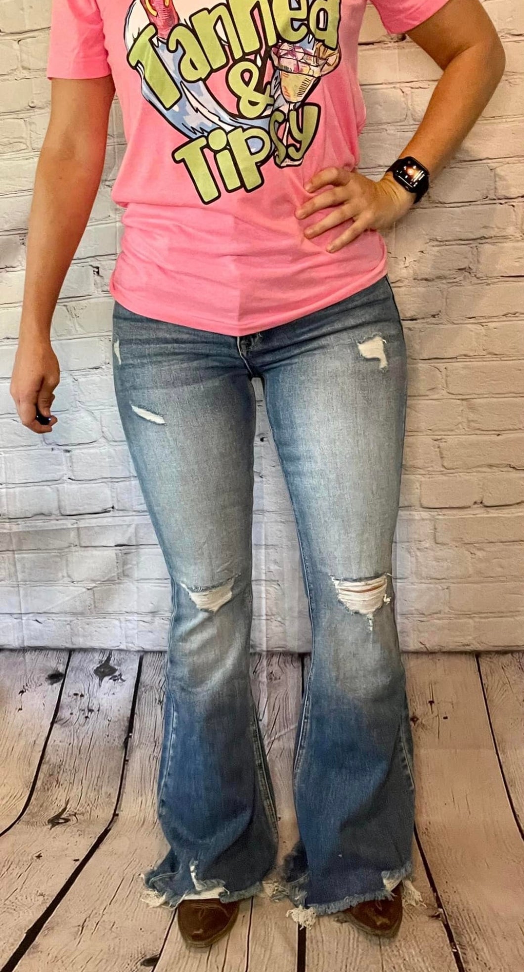 Light wash destroyed hem flares